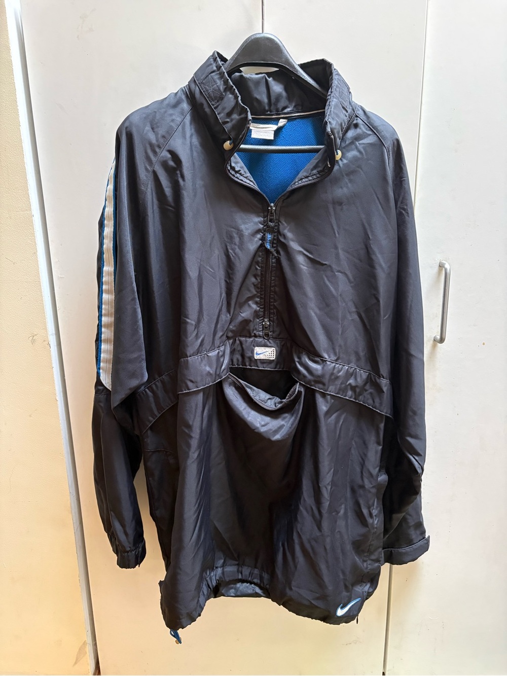 Nike Black Pullover Windbreaker with Blue Lining and Stripe Accents